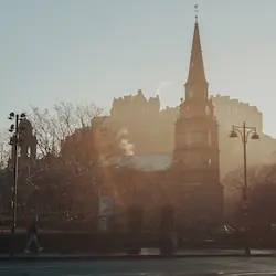 Edinburgh Castle dominating the skyline, perched atop Castle Rock with panoramic views of the city.