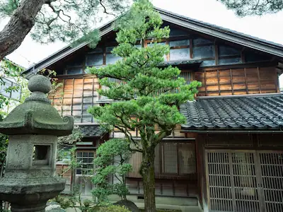 The exterior of Bluebell Corner, a distinctive holiday cottage near Beauly, blending Highland tradition with subtle Far Eastern influences.