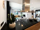 A spacious modern kitchen featuring ample counter space, perfect for cooking and meal preparation.