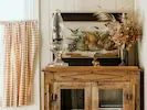 Cosy room at Lily Pad Lodge showcasing rustic furniture and warm decor.