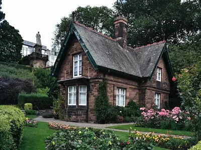 Rose Manor, a large country house surrounded by meticulously designed and picturesque gardens.