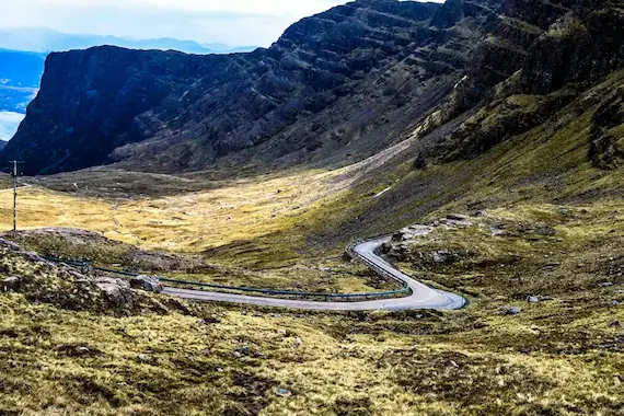 Bealach na Bà, a winding mountain pass with steep, dramatic bends and breathtaking Highland scenery.