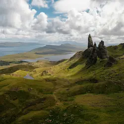 The iconic Old Man of Storr, a towering rock formation set against a backdrop of dramatic landscapes.